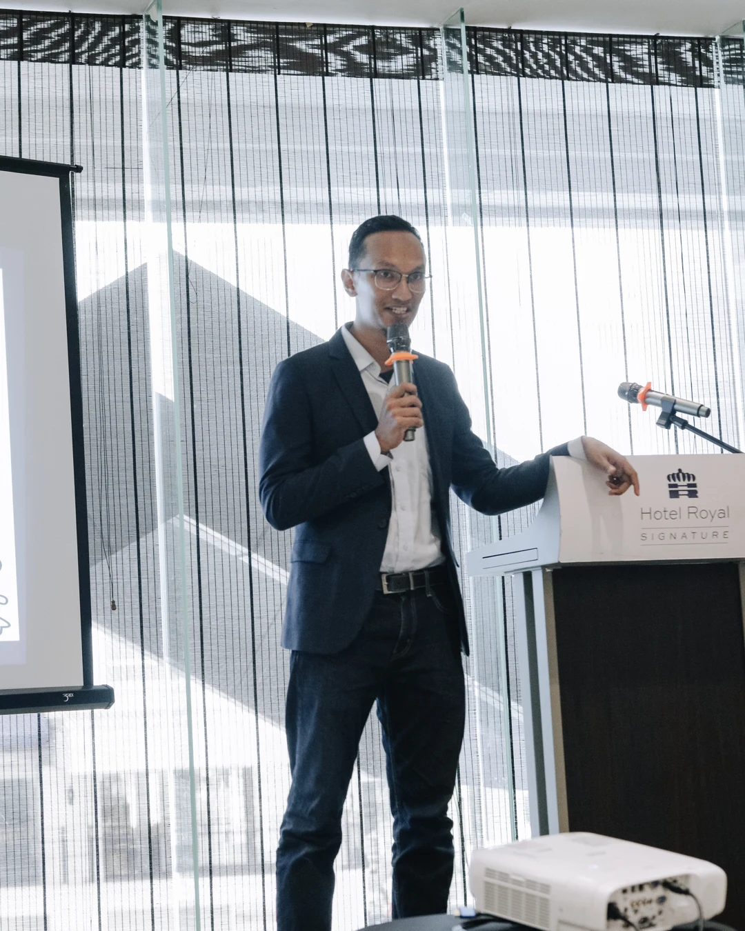 Huzaifah Za'ba speaking at an industry event in Malaysia