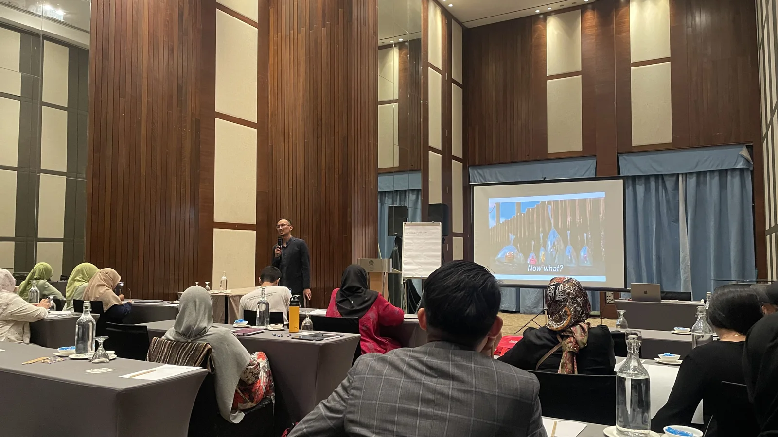 Huzaifah Za'ba presenting to a seminar room of business owners and founders